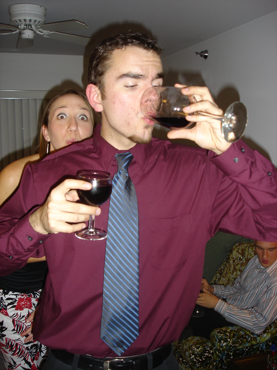Steve double-fisting wine glasses